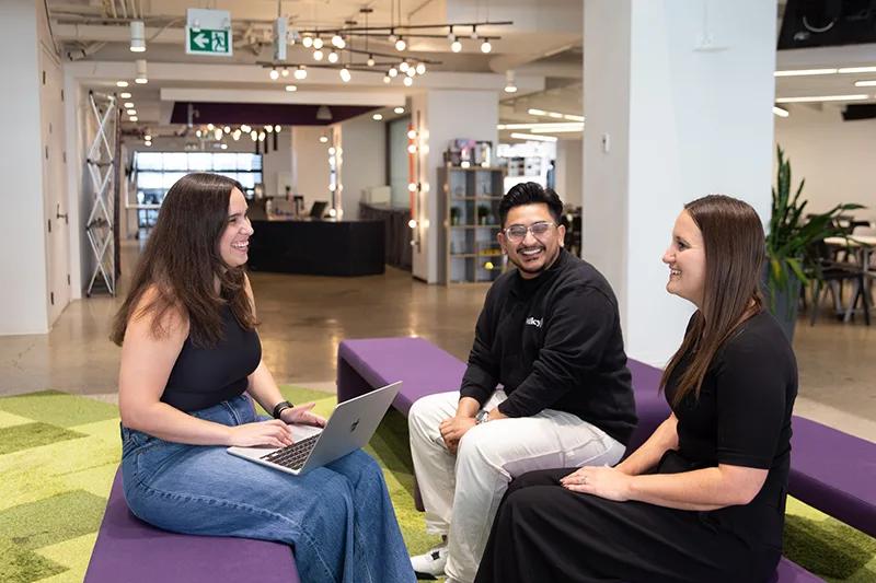 PolicyMe employees collaborating at the company’s downtown Toronto office.